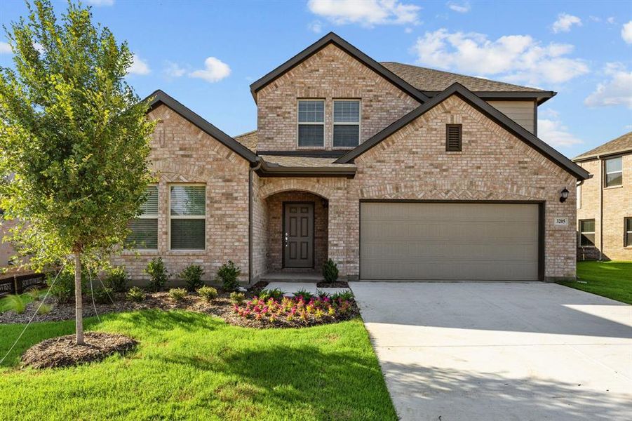 Front exterior of a new home in Kings Way, Denton, TX, highlighting curb appeal (Image 1). Front exterior of a new home in Kings Way, Denton, TX, highlighting curb appeal (Image 1).