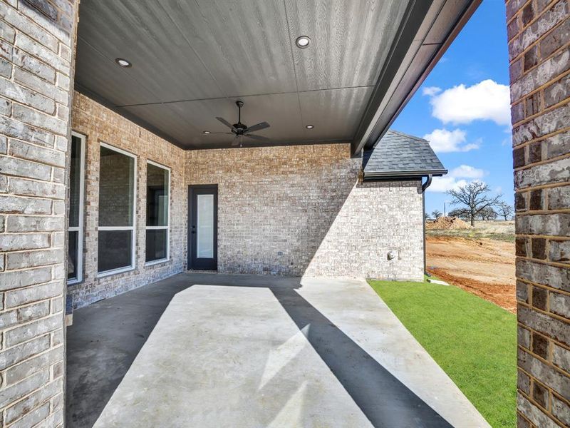 View of patio featuring ceiling fan