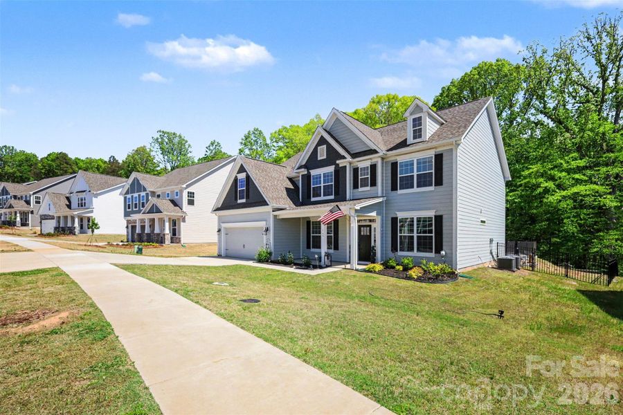 Front exterior of a new home in Falls Cove, Troutman, NC, highlighting curb appeal (Image 27).
