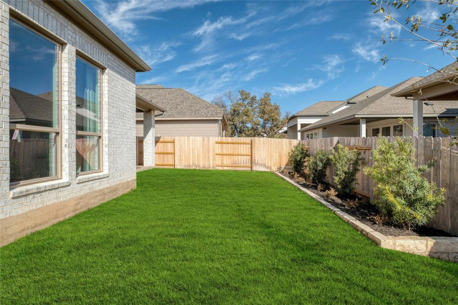 Exterior details and patio area of a home in Lariat 45', Liberty Hill (Image 19).