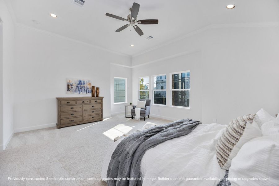 Bask in all-day sunshine thanks to walls of windows in this luminous bedroom. Whether you’re curling up with a book or sipping your first coffee—this space just feels good.