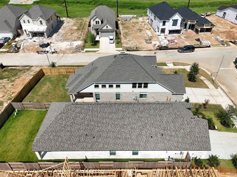 Spacious modern home with a large fenced backyard, ideal for outdoor activities. Situated in a developing neighborhood with ongoing construction, offering potential for growth and investment.