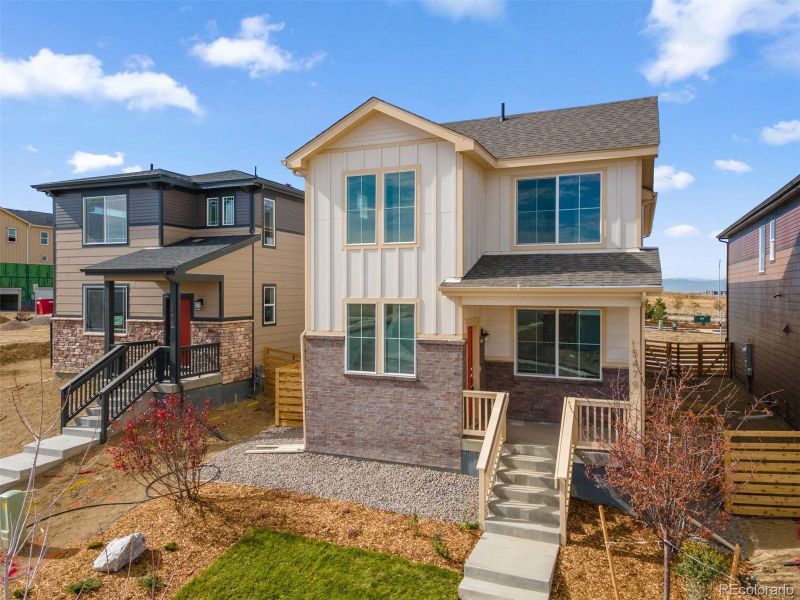 Front exterior of a new home in The Casitas Collection at Windler, Aurora, CO, highlighting curb appeal (Image 2). Front exterior of a new home in The Casitas Collection at Windler, Aurora, CO, highlighting curb appeal (Image 2).