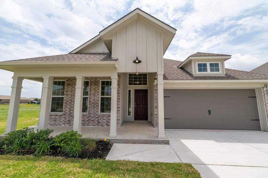 Front exterior of a new home in Pecan Grove, Navasota, TX, highlighting curb appeal (Image 1). Front exterior of a new home in Pecan Grove, Navasota, TX, highlighting curb appeal (Image 1).