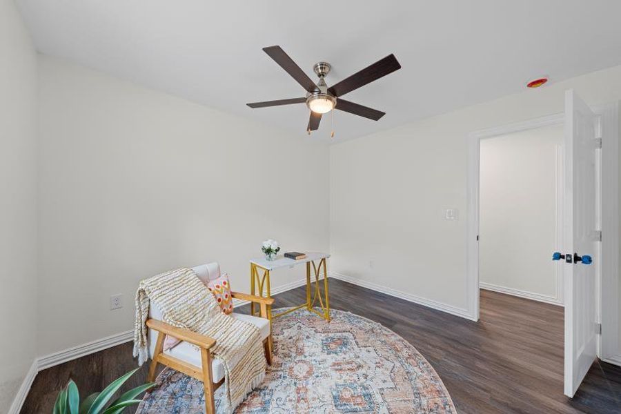 Sitting room featuring a ceiling fan and wood finished floors Sitting room featuring a ceiling fan and wood finished floors