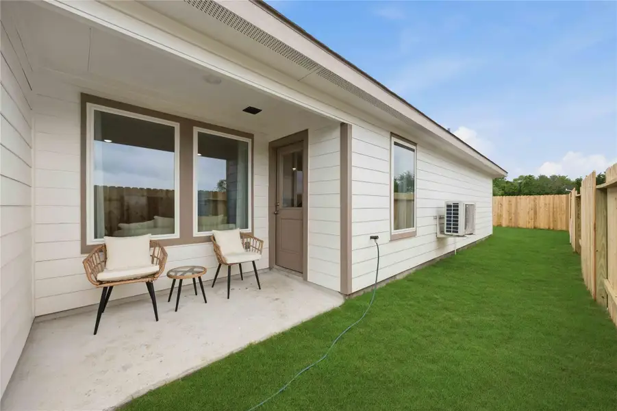 Exterior details and patio area of a home in Pineapple Square, Houston (Image 2). Exterior details and patio area of a home in Pineapple Square, Houston (Image 2).
