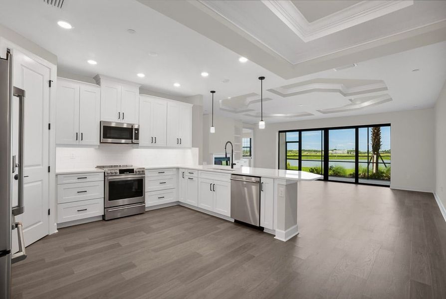 Furnished interior view inside a new home in Esplanade by the Islands Coach Homes, Naples (Image 8). Furnished interior view inside a new home in Esplanade by the Islands Coach Homes, Naples (Image 8).