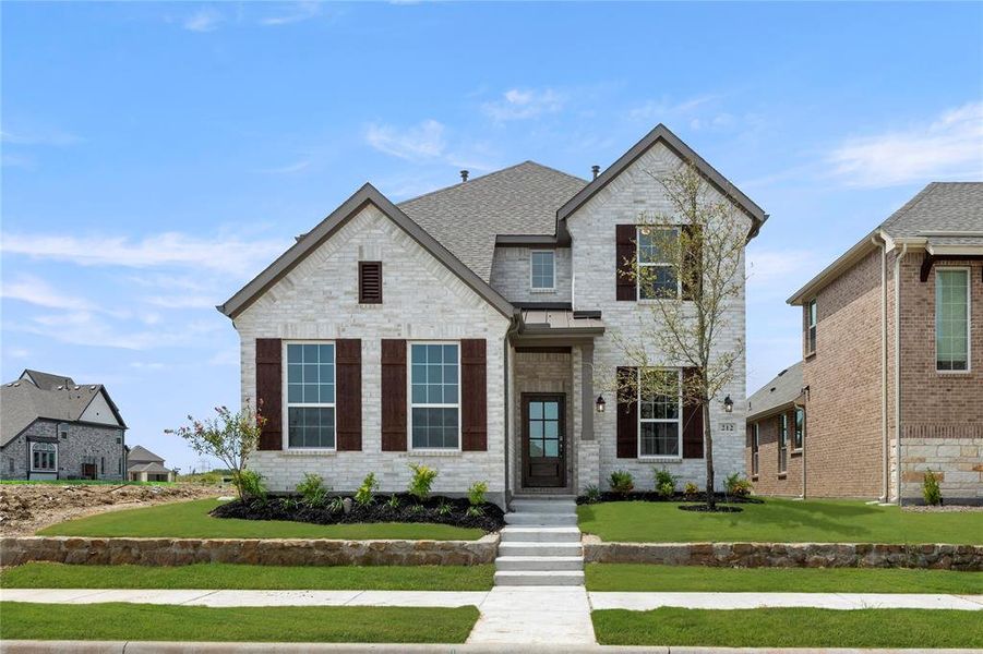 Front exterior of a new home in Edgewater, Fate, TX, highlighting curb appeal (Image 2). Front exterior of a new home in Edgewater, Fate, TX, highlighting curb appeal (Image 2).