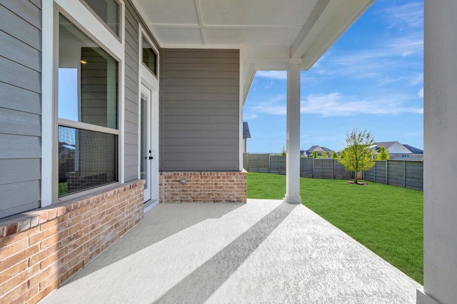 Exterior details and patio area of a home in Treeline, Justin (Image 4).