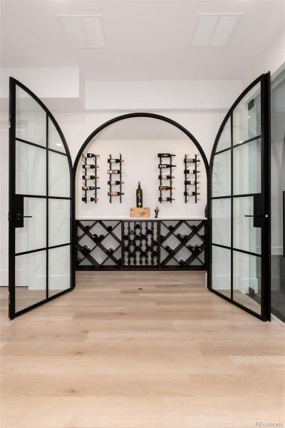 Wine Room with custom iron doors Wine Room with custom iron doors
