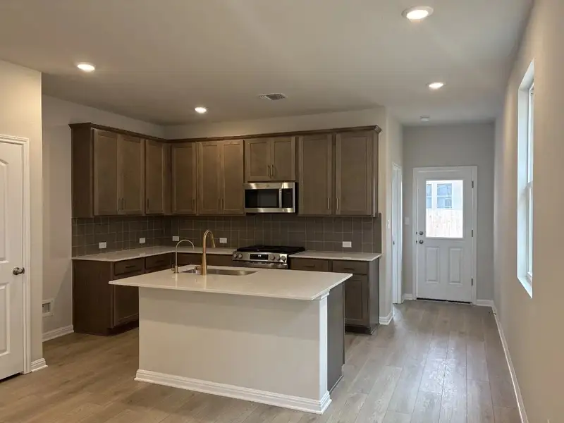 Furnished interior view inside a new home in La Cima, San Marcos (Image 3).