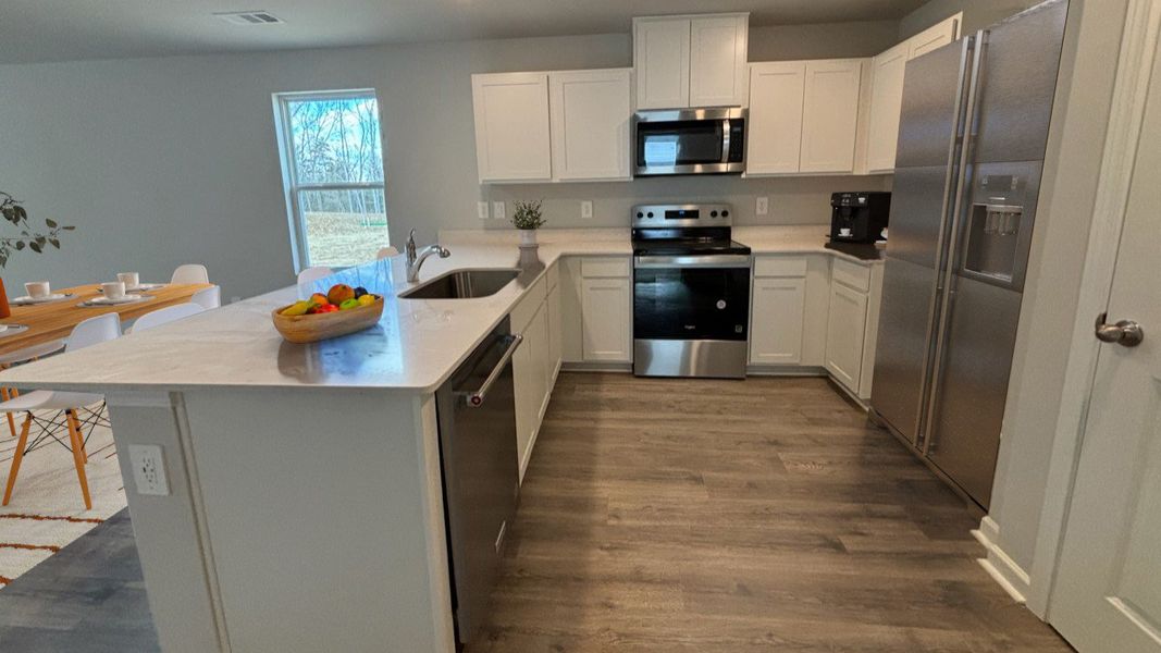 Furnished interior view inside a new home in Saddle Trace, Lewisburg (Image 4).