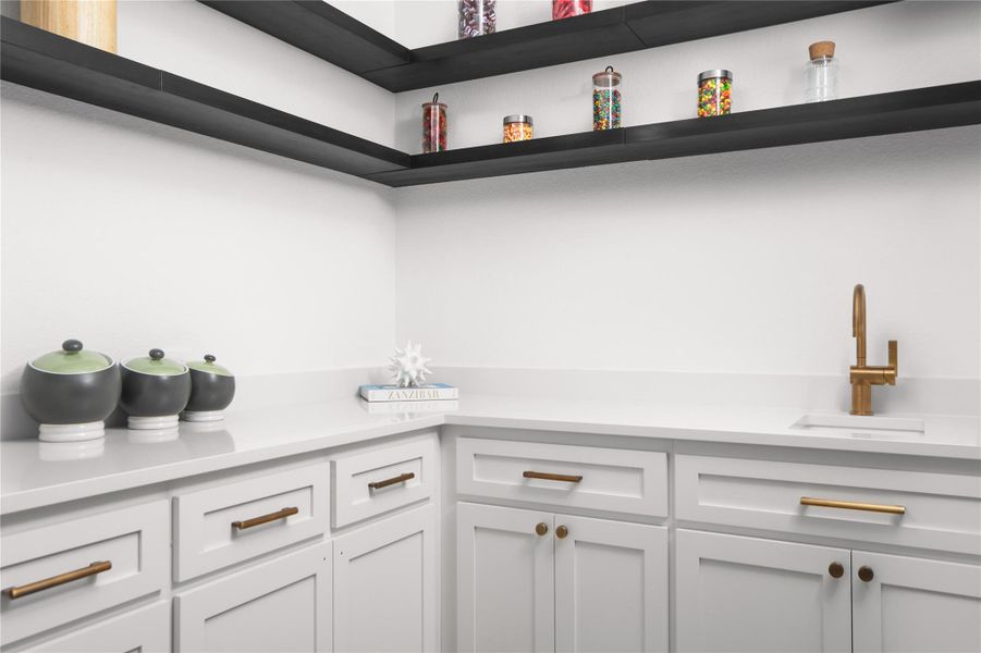 The butler's pantry not only offers ample storage but also showcases exquisite design details, making it an essential extension of the kitchen