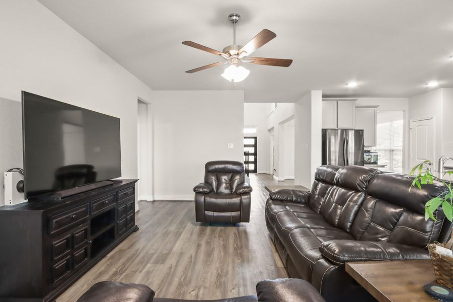 another view of the living room facing the front door. Owners retreat to the left.