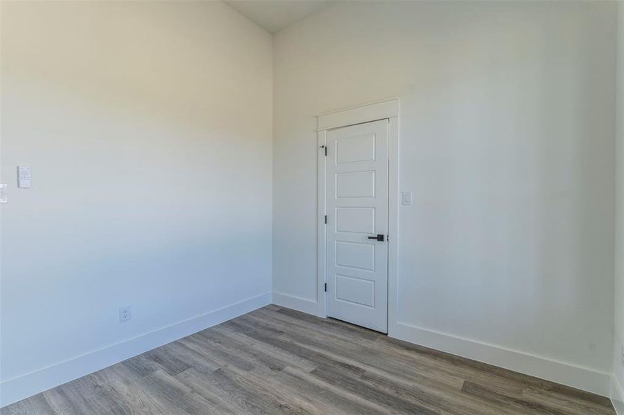 Unfurnished room with light wood-type flooring