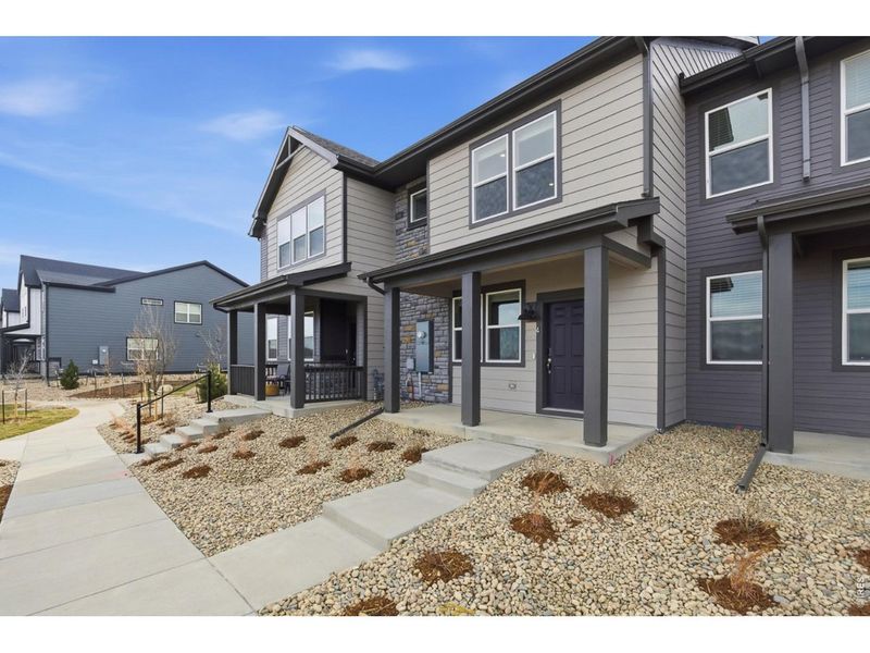Exterior details and patio area of a home in Poudre Heights: The Meadow Collection, Windsor (Image 20).