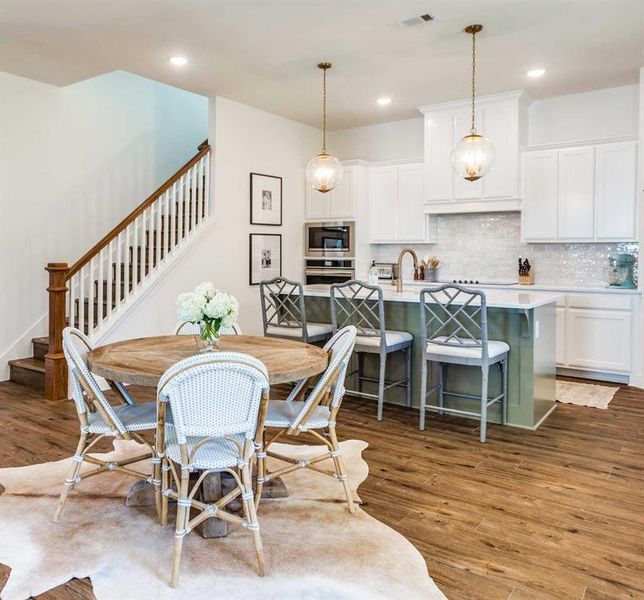 Dining room with dark hardwood / wood-style floors