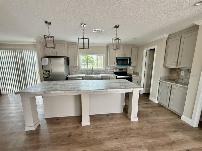 Furnished interior view inside a new home in , Okeechobee (Image 13).