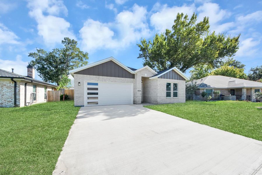 Front exterior of a new home in , Pasadena, TX, highlighting curb appeal (Image 26).