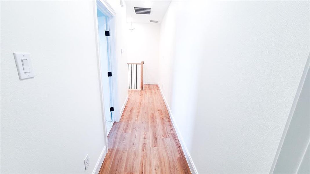 Hall featuring light wood-type flooring