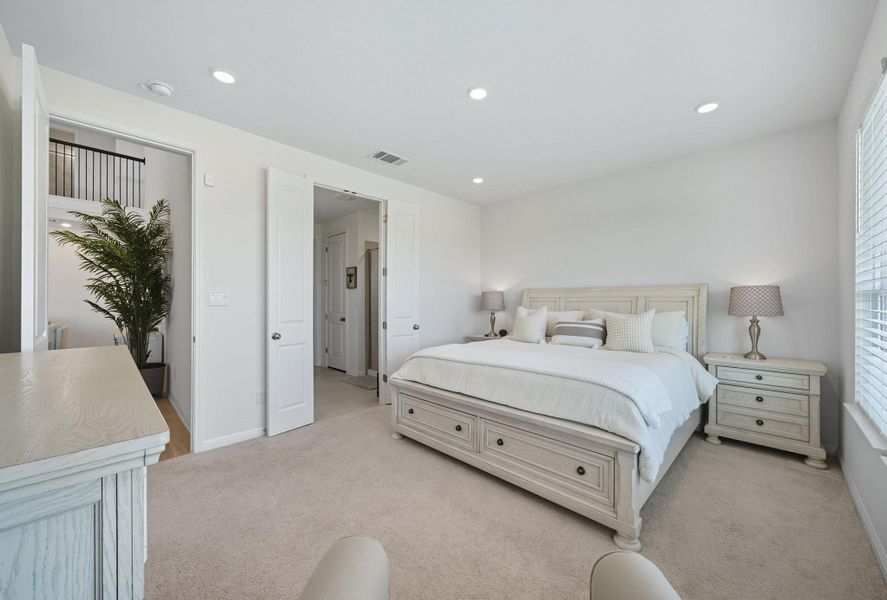 Bedroom with light colored carpet and recessed lighting Bedroom with light colored carpet and recessed lighting