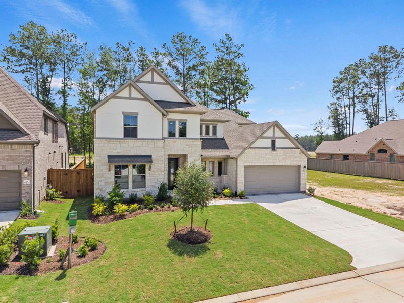 Front exterior of a new home in The Highlands, Porter, TX, highlighting curb appeal (Image 22).