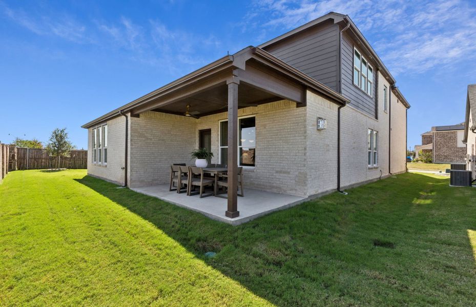Exterior details and patio area of a home in Whitewing Trails, Princeton (Image 2).