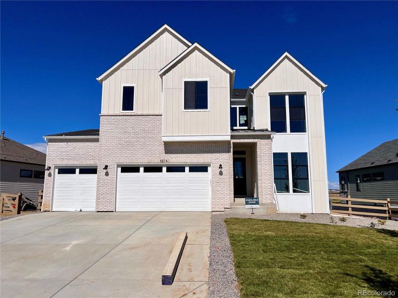 Front exterior of a home in the Kitchel Lake at Serratoga Falls community, located in Timnath, CO (Image 13).