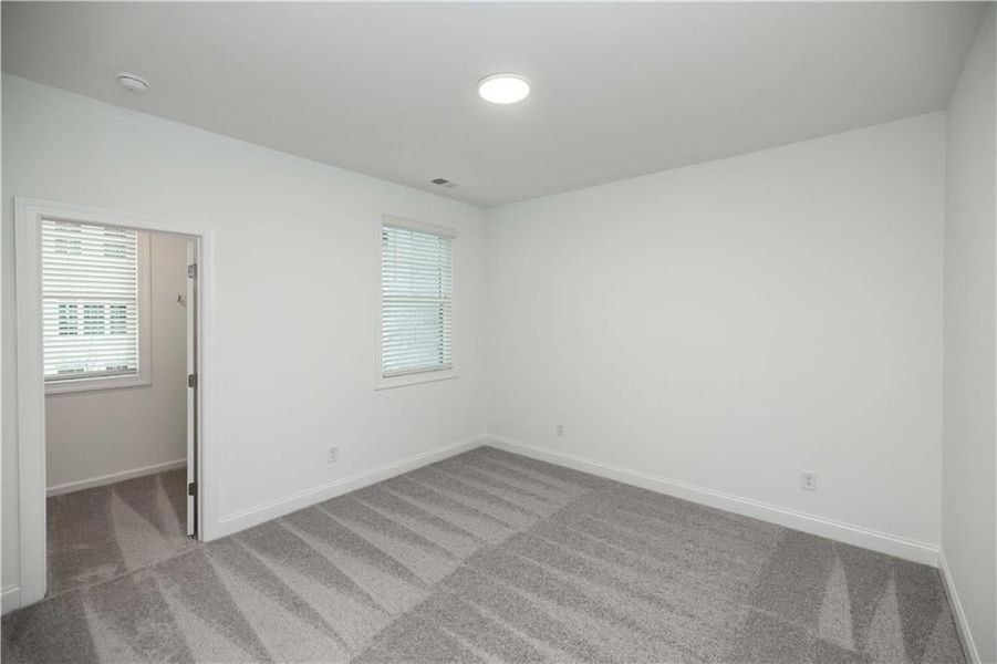 Unfurnished room featuring carpet flooring