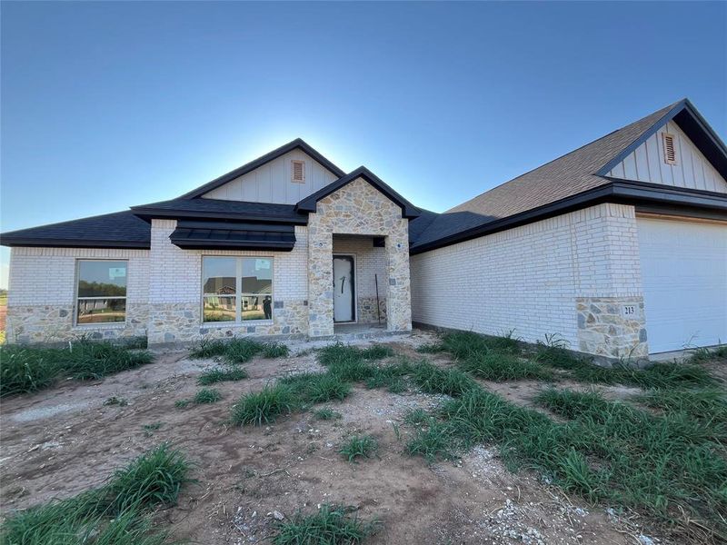 Front exterior of a new home in , Millsap, TX, highlighting curb appeal (Image 1).