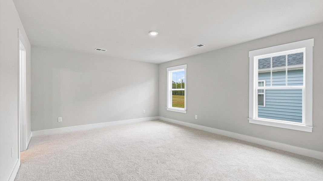 Vibrant natural light fills this exceptional primary suite with eye-catching details Vibrant natural light fills this exceptional primary suite with eye-catching details