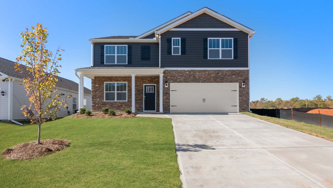 Front exterior of a new home in Foxbank, Gray Court, SC, highlighting curb appeal (Image 1). Front exterior of a new home in Foxbank, Gray Court, SC, highlighting curb appeal (Image 1).