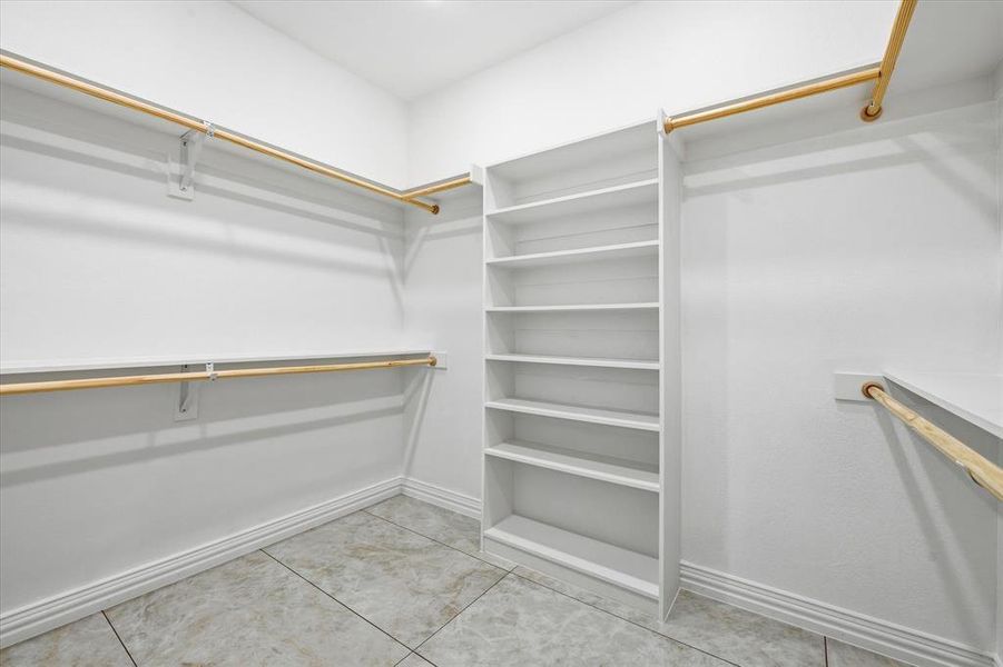 Walk in closet featuring light tile patterned flooring