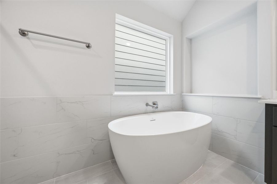 Soak in Serenity: End your days or start your weekends enveloped in the embrace of a luxurious soaking tub in this exquisitely designed primary bathroom.
