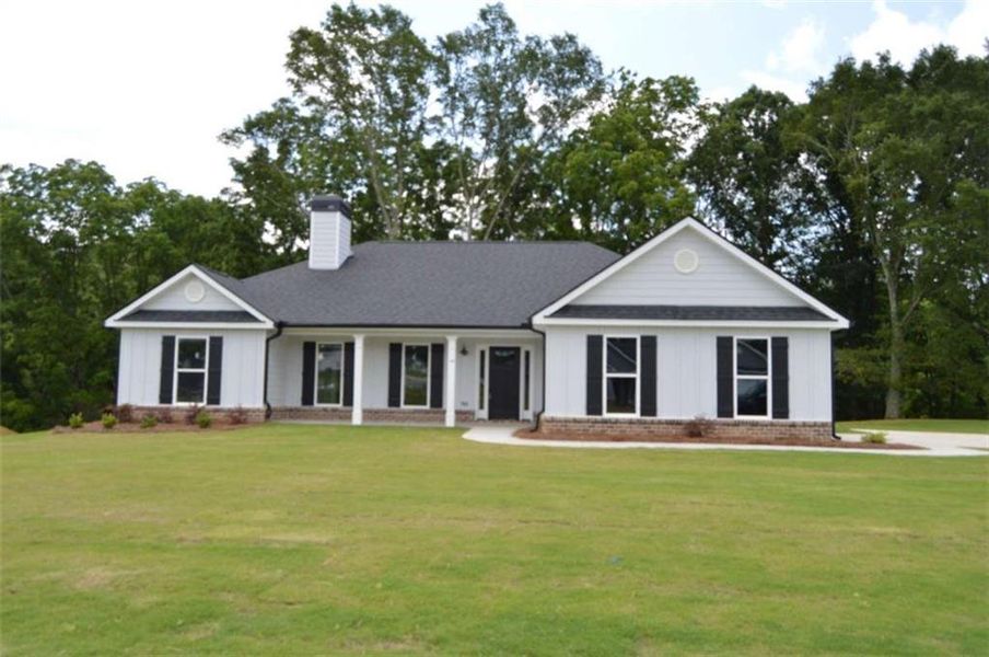 Front exterior of a new home in , Winder, GA, highlighting curb appeal (Image 1).