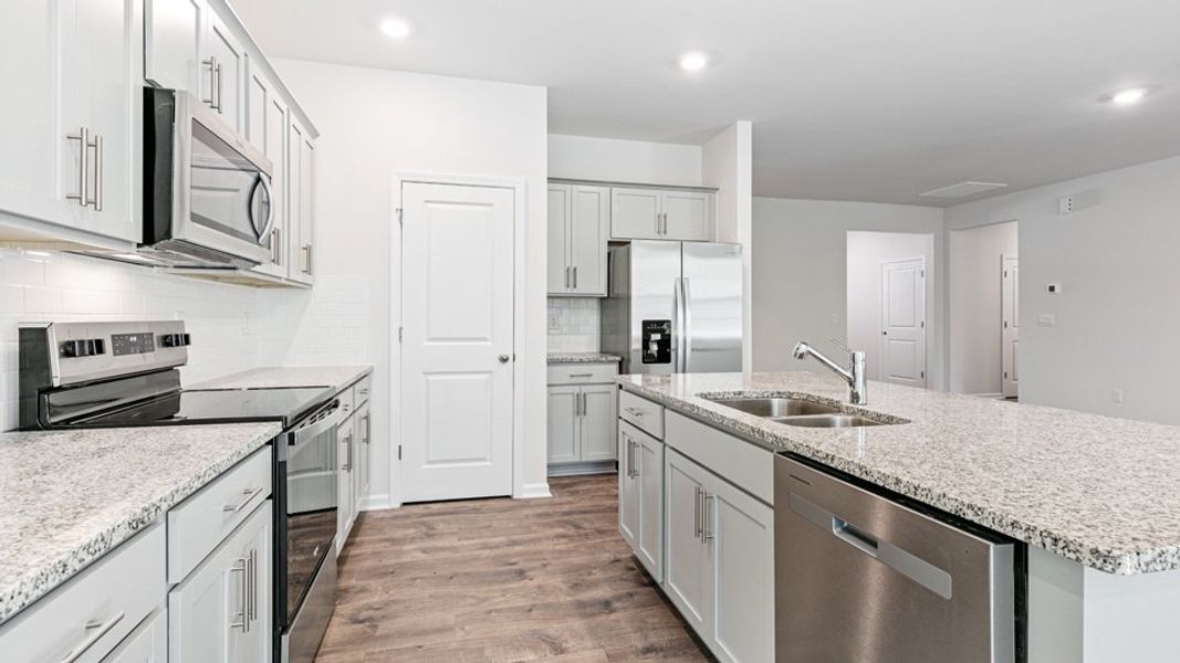 Representative furnished interior of a home built from the Booth by D.R. Horton in River Stone, Elm City (Image 6).