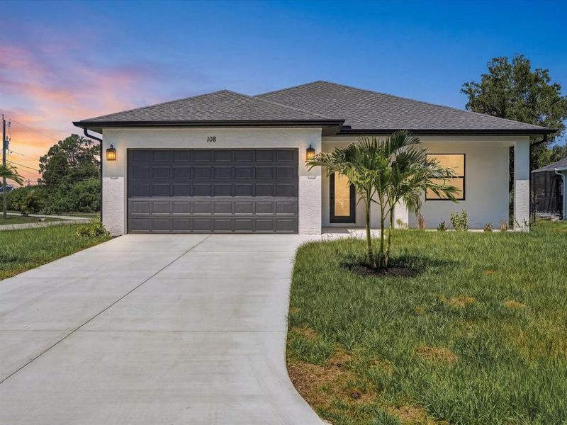 Front exterior of a new home in , Rotonda West, FL, highlighting curb appeal (Image 22).