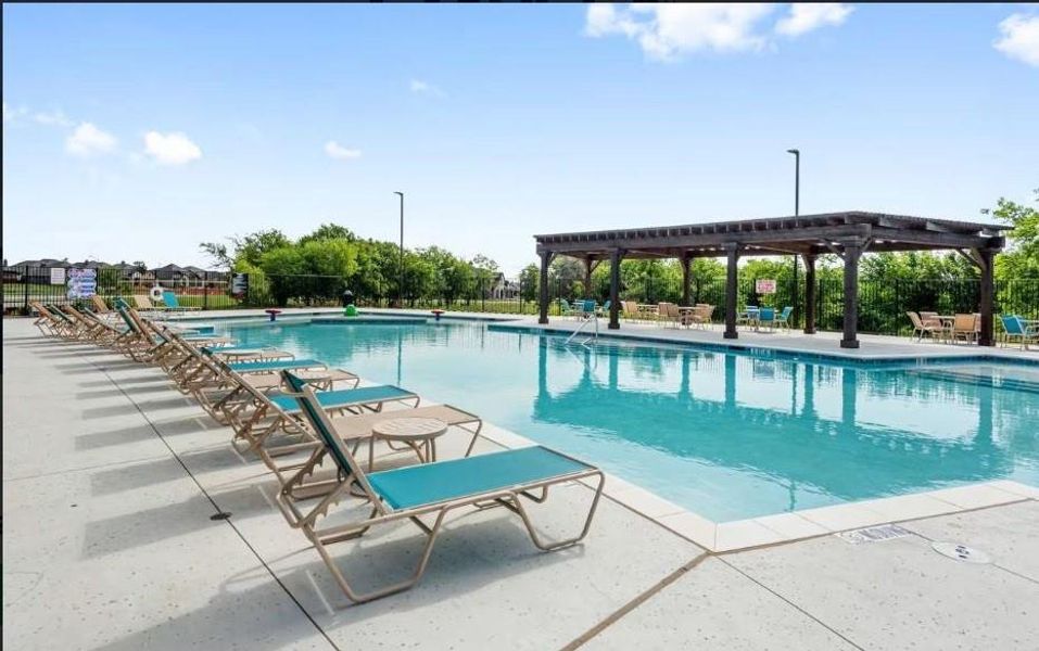 Community pool featuring a pergola and a patio area Community pool featuring a pergola and a patio area