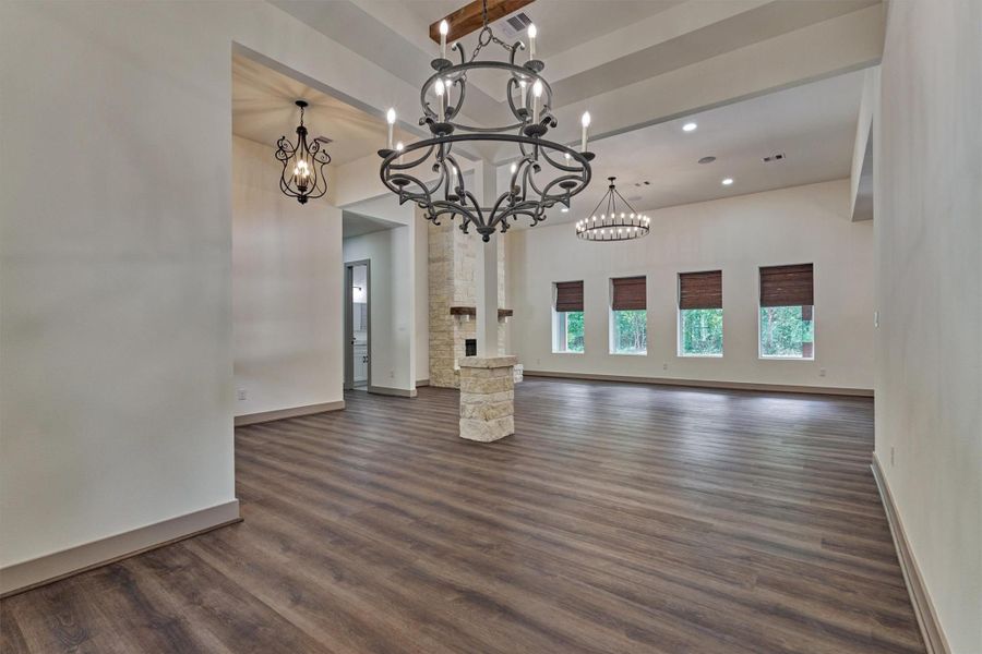 The dining area enjoys beautiful views of the surrounding trees, while the ornate light fixtures add elegance and charm and creates a warm and inviting space