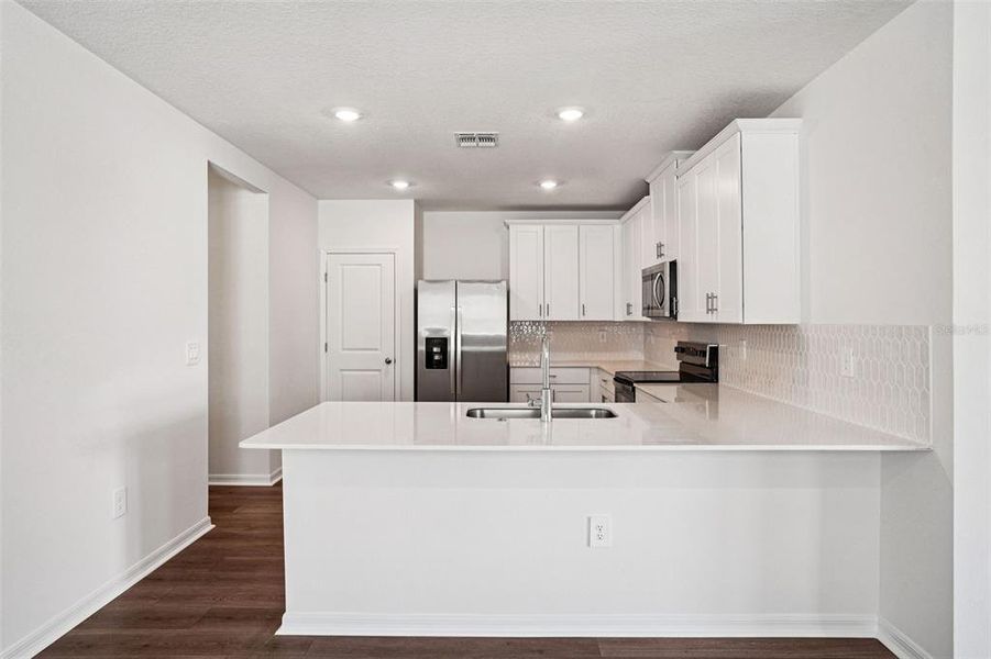 Furnished interior view inside a new home in Ridgehaven - Villas, Ormond Beach (Image 5).