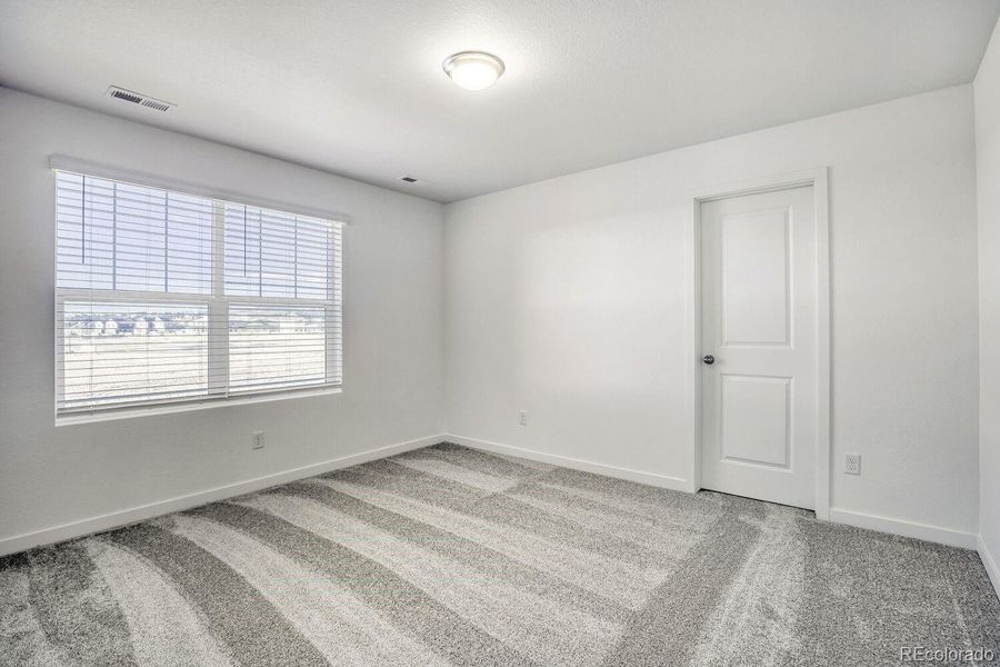 Spacious, unfurnished interior of a new home in Riano Ridge, Loveland (Image 7).