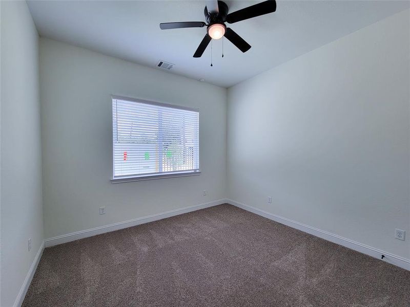 One of two secondary bedrooms; 1st floor.