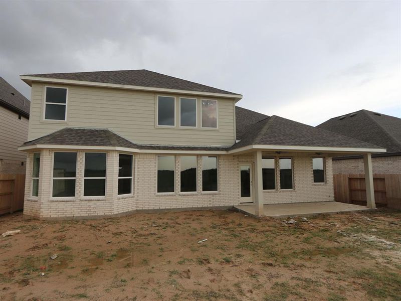 Front exterior of a new home in Marvida, Cypress, TX, highlighting curb appeal (Image 17).