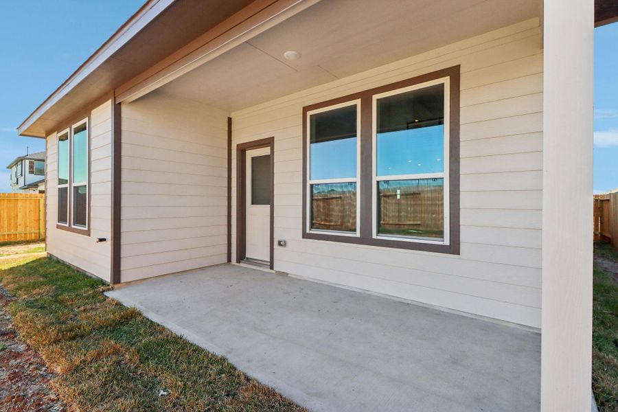 Exterior details and patio area of a home in Bluestem, Brookshire (Image 23).