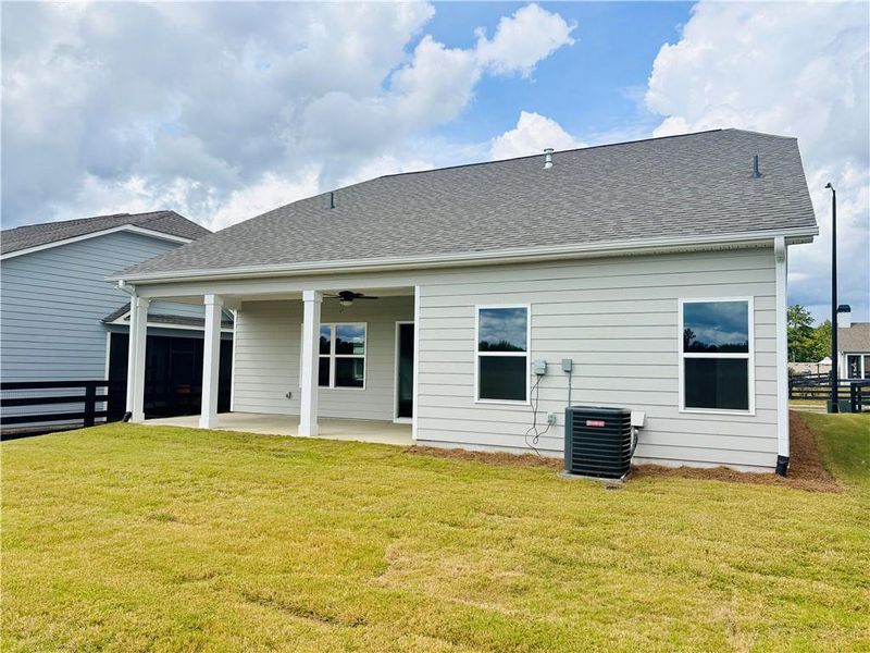 Exterior details and patio area of a home in Heritage Pointe at The Georgian, Villa Rica (Image 14).