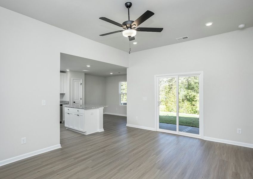 The spacious living room leads directly to your new backyard.