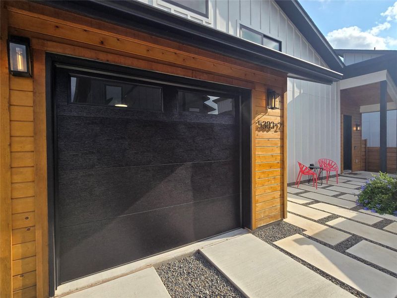 Garage door is insulated and has the windows up top for privacy and natural light. Garage door is insulated and has the windows up top for privacy and natural light.