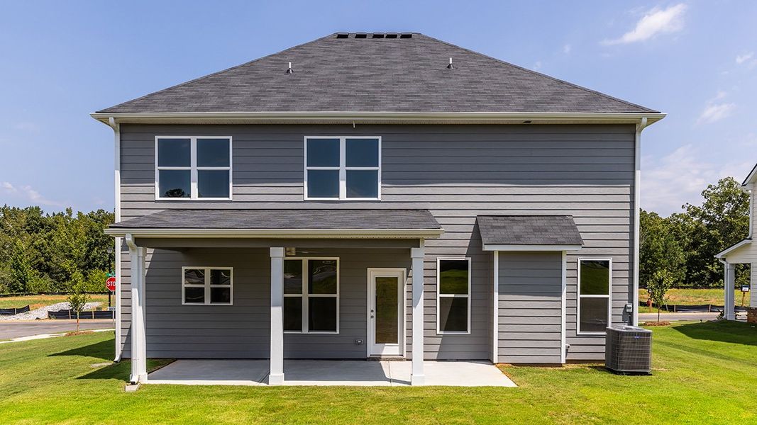 Exterior details and patio area of a home in Evergreen Crossing, Locust Grove (Image 2).