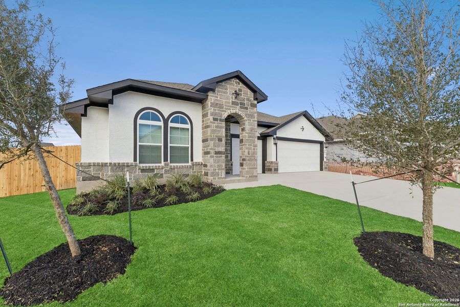 Front exterior of a new home in Davis Ranch 60', San Antonio, TX, highlighting curb appeal (Image 18).