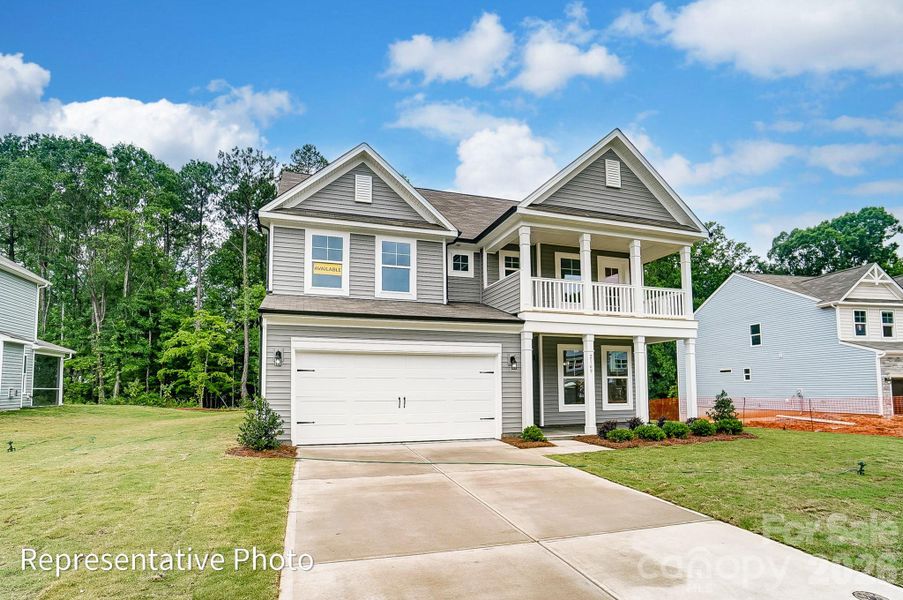 Front exterior of a new home in , Troutman, NC, highlighting curb appeal (Image 21).